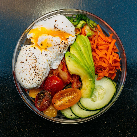 Nutrient-dense bowl with poached eggs and kimchi